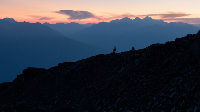 Alpenglow on far off mountain range