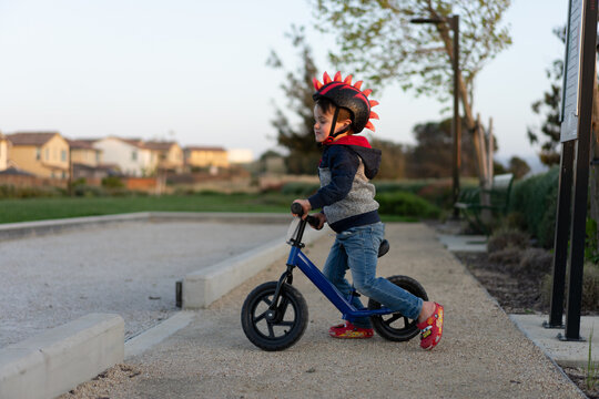 Young Boy riding a balance bike
