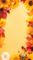 Autumn leaves, sunflowers, and other fall elements arranged on a yellow background, creating a visually appealing frame