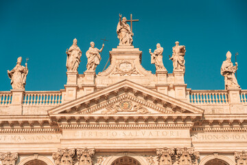 08 08 2025 Rome, Italy - Statues on top of Basilica San Giovanni in Laterano
