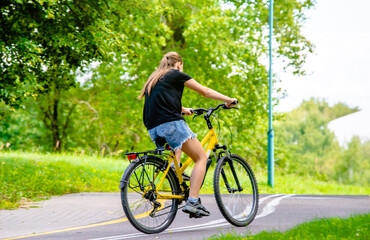 Fototapeta premium Cyclist ride on the bike path in the city Park 