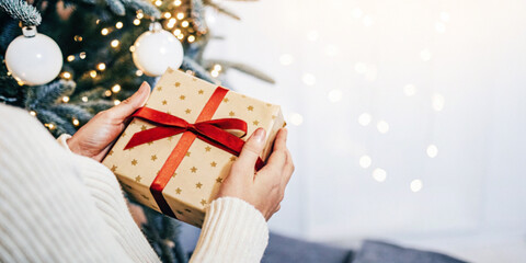 Festival background. Giving gifts to loved ones during the Christmas holiday with a second hand...