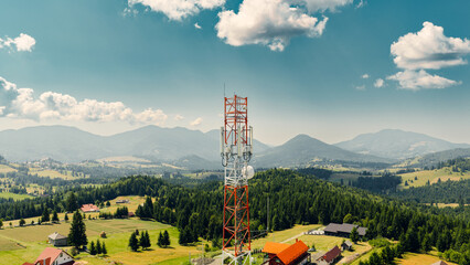 Telecommunication tower dominating mountain landscape providing wireless network coverage
