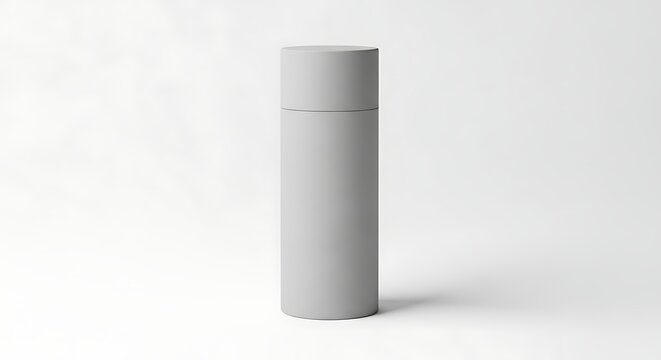 Minimalist mockup of a gray cylindrical packaging container on a white surface studio