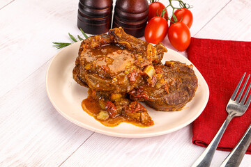 Italian cuisine - ossobuco with sauce