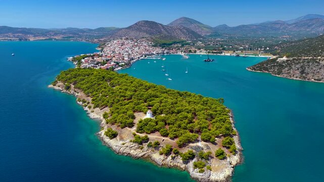 Panoramic aerial view of the town and marina of Ermioni, Peloponese, Greece, with the old lighthouse in front