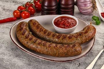 Grilled beef sausages with sauce