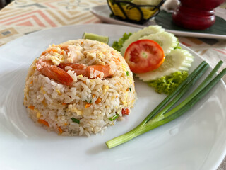 Fried rice with shrimp and vegetables on white plate, Thai food