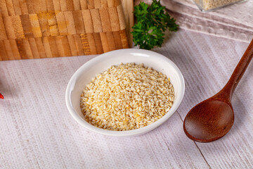 Raw dry sesame seeds heap