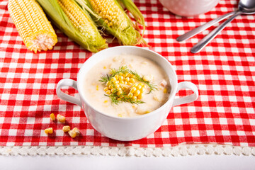Delicious creamy corn soup in a bowl. Autumn food. Harvest concept