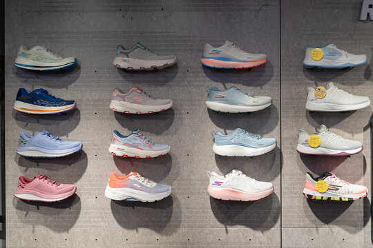 Skechers sneakers on concrete wall
