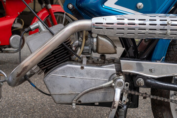 Fototapeta premium Motorcycle engine is shown with a black chain