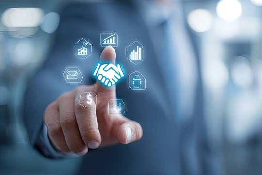 Businessman's finger touches a digital handshake icon surrounded by business-related graphics