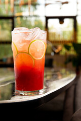 Red cocktail. On background. Selective focus.