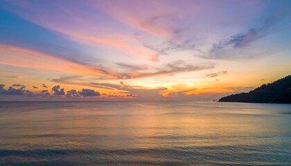 Fototapeta premium Vibrant Sunset Over the Calm Ocean Waters with Colorful Sky.