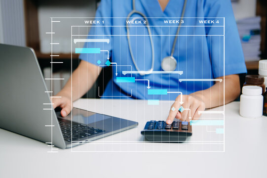 Nurse using laptop and calculator for healthcare planning and data analysis, highlighting modern medical management and digital workflow solutions.