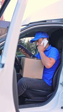 courier service employee uses smartphone in van for delivering parcels. concept logistics, delivery services