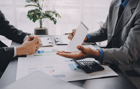 Accounting company provide finance and taxation planning for profitable cash flow, Auditor and accountant team working in office, analyze financial data and accounting record with calculator.Insight