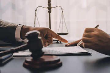Lawyer explained to the client about the law that must be brought against the court case.