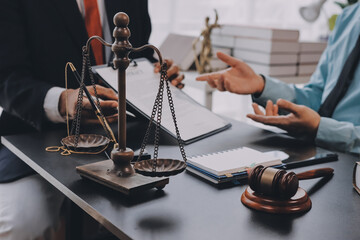 Lawyer explained to the client about the law that must be brought against the court case.