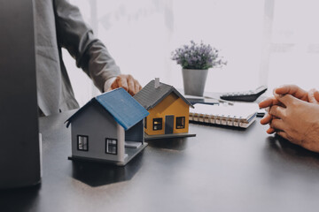 Real estate broker agent presenting and consult to customer to decision making sign insurance form...