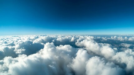 Fototapeta premium View of fluffy clouds overhead aerial perspective nature photography clear blue sky serene atmosphere tranquil scene