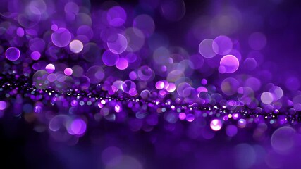 A blurred background featuring a variety of purple and blue bokeh lights, creating a magical and dreamy effect.