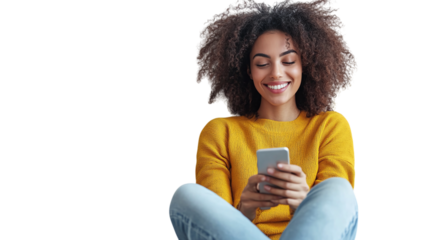 Woman seated casually at home smiling while texting on smartphone isolated on transparent background