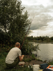 A young man fishing on a lake