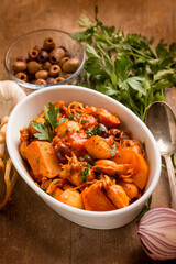 squid with tomato sauce olives and potatoes