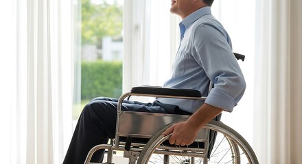 Obraz premium Smiling Man in Wheelchair Gazing Out a Window at Home