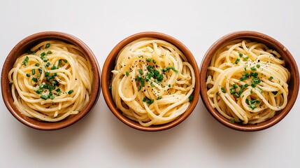 Three bowls of spaghetti in different shapes, placed at different angles to show off their shape, are perfect for online food social media posts or advertising banners.