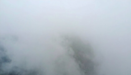 Dense Fog Blanket Covering Mountain Surface
