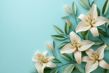 Fototapeta premium Delicate cream lilies and vibrant greenery arranged artfully on a light turquoise background.
