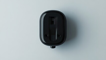 Top-down view of a matte black oval-shaped device
