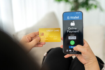 E-wallet payment, credit card transaction and digital finance concept, woman holding smartphone and credit card making secure online shopping purchase, fintech, e-commerce and digital wallet payment