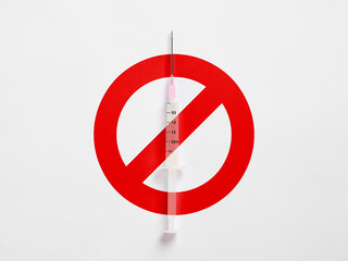 Syringe with prohibition sign representing stop drug addiction or anti vaccine movement.