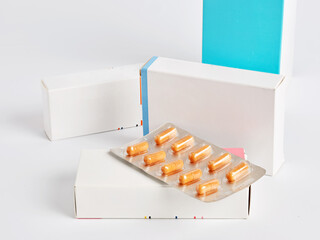 Blister Pack of Pills Resting on Medicine Boxes