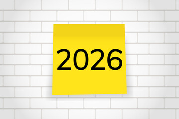 2026. goals. plan. new year. A yellow sticky note with the number “2026” written in bold black font, placed on a squared notebook paper background.