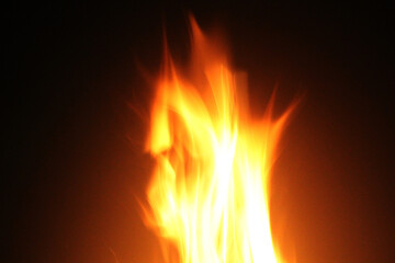 Close up burning flames on black background for graphic design or wallpaper.