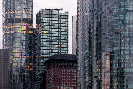 Tall office buildings in Frankfurt, Germany, financial district, symbolizing modern corporate architecture with reflective facades, vertical design and contemporary urban development