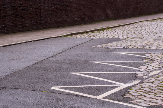 Painted parking sign on asphalt in Hamburg, Germany, showing urban details of street regulation, infrastructure and the integration of modern transport planning in public environments