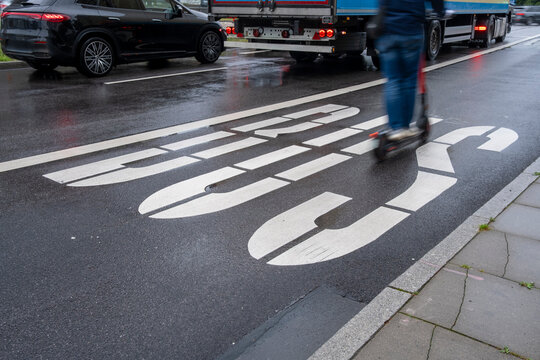 Pedestrian crossing and painted bus lane in Hamburg, Germany, symbolizing urban mobility, transport infrastructure and contemporary street details in European public environments