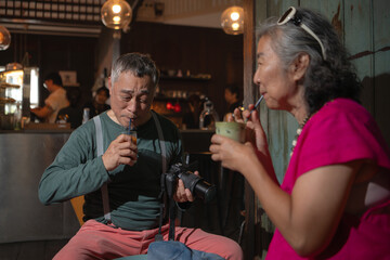 Senior couple enjoying coffee in a cozy cafe,