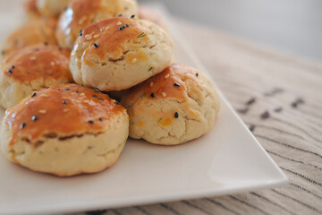 turkish savory pastry pogaca with dill and black sesame or cumin, homemade quick snack