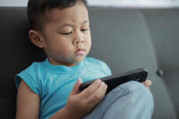 little boy playing video game