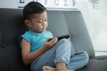 boy playing video game