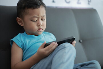 boy playing video game