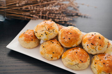 turkish savory pastry pogaca with dill and black sesame or cumin, homemade quick snack