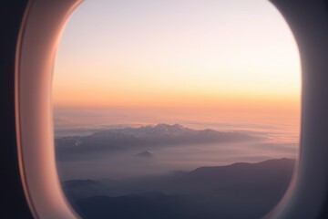 Serene view from airplane window showcasing distant mountains at